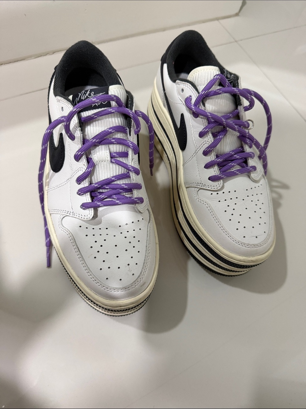 Nike White Sneakers with Black Swoosh and Purple Laces